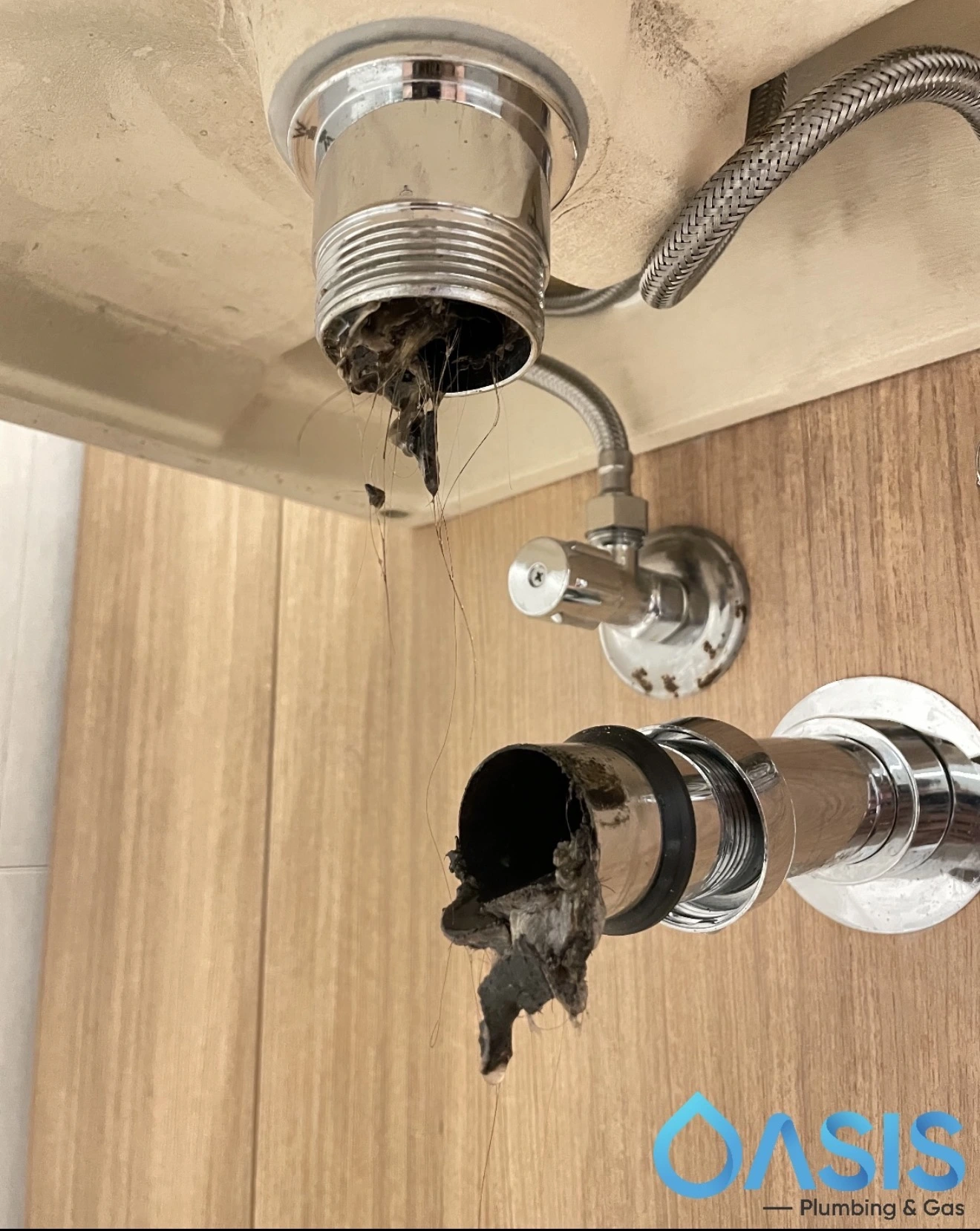 blocked drain, blocked basin sydney cbd plumbing job photo